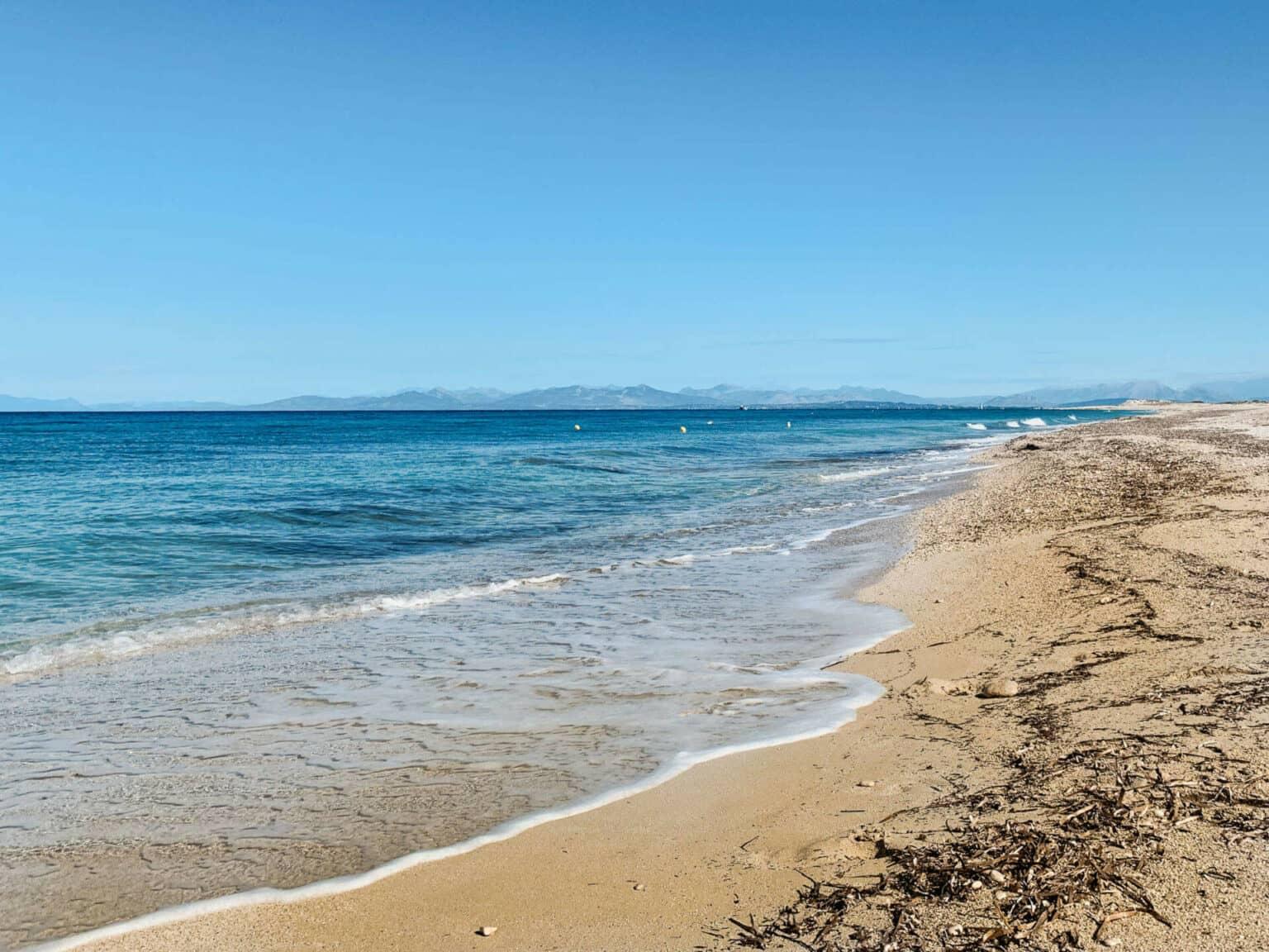 Gentle waves wash the sea onto the fine sandy beach near Greece's capital, Athens.