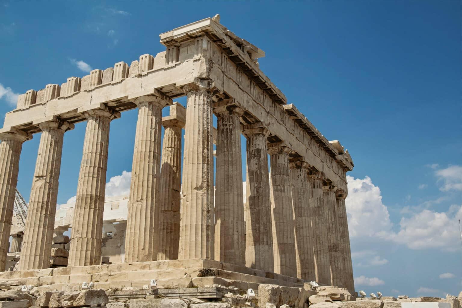A temple on the Acropolis in Athens from a frog's perspective, with a blue sky above.