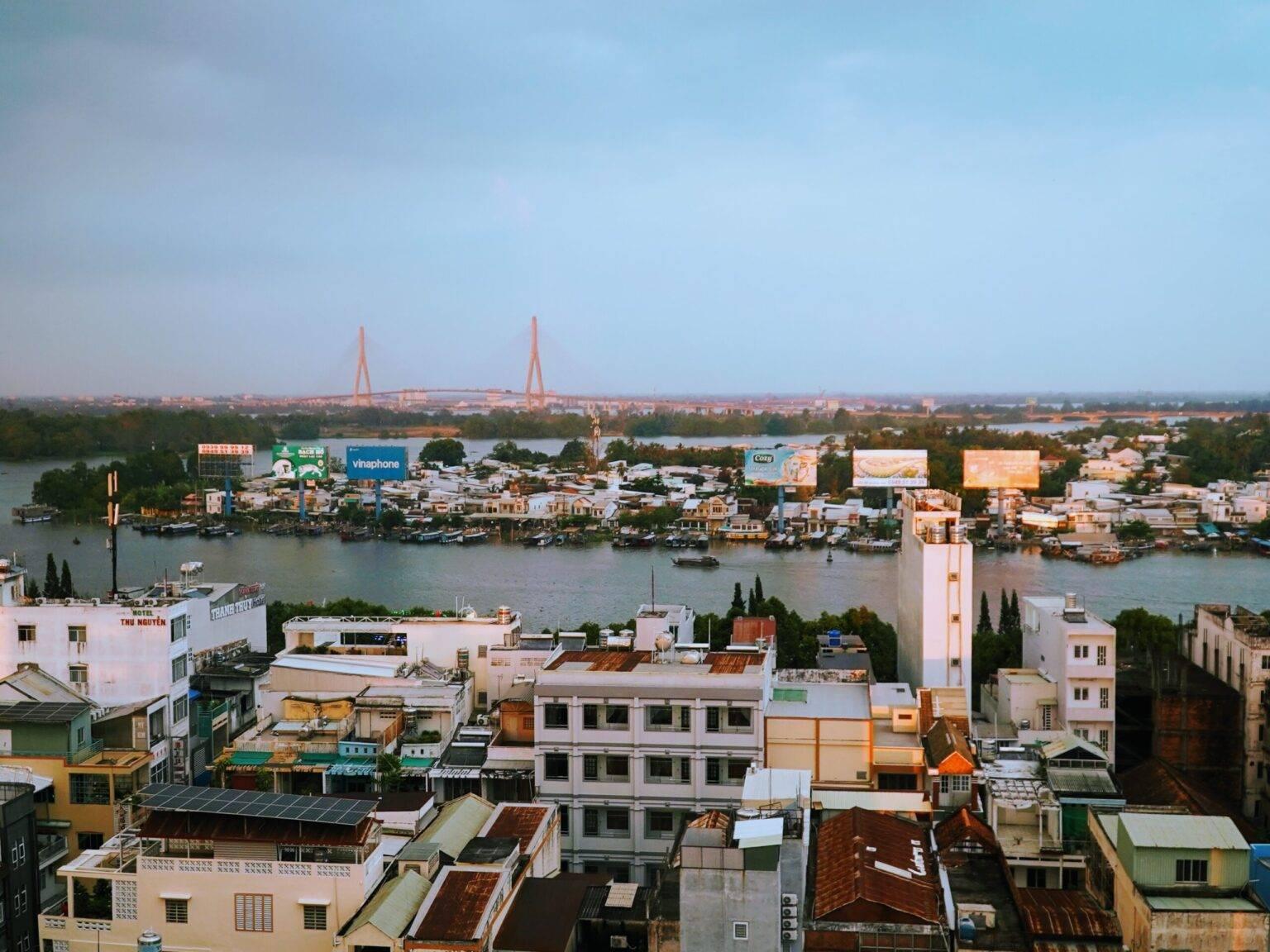 Panorama of Can Tho with the river at the center and developed banks on both sides.