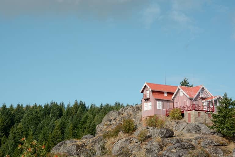 A red house on a mountain.