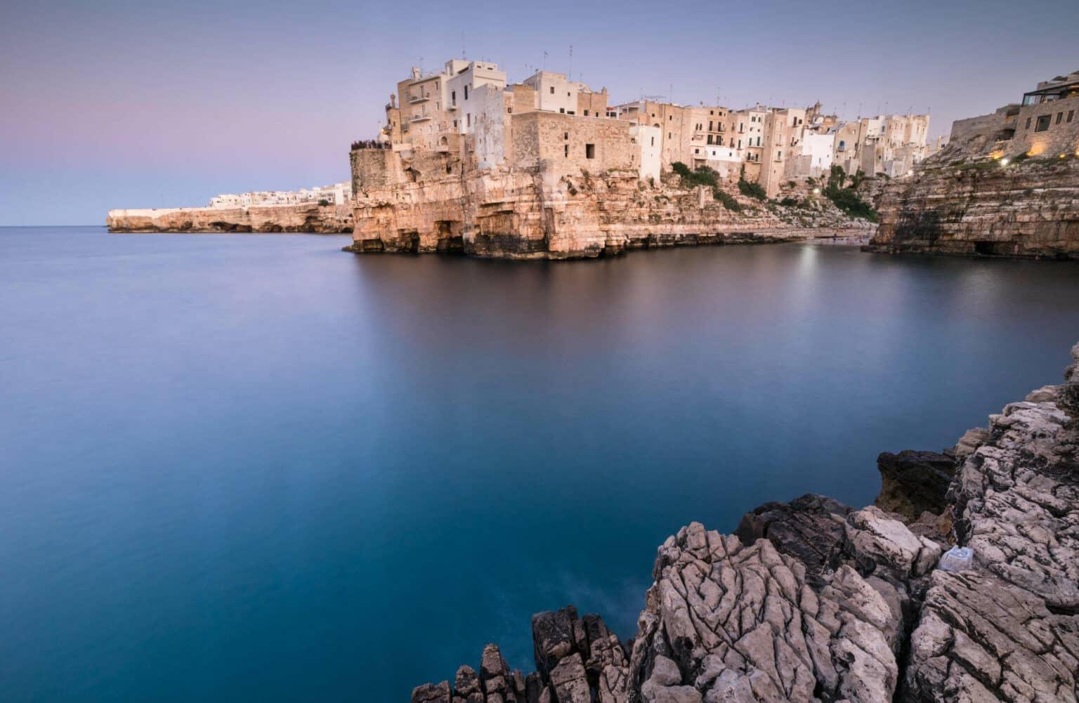 A long exposure shot of the town Polignano a Mare in Italy.