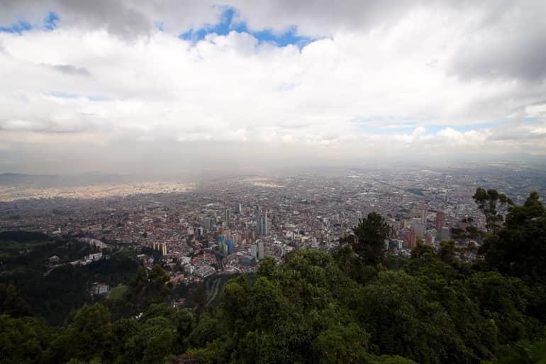 Clouds obscure the view over Bogotá from Colombia's Monserrate Mountain.
