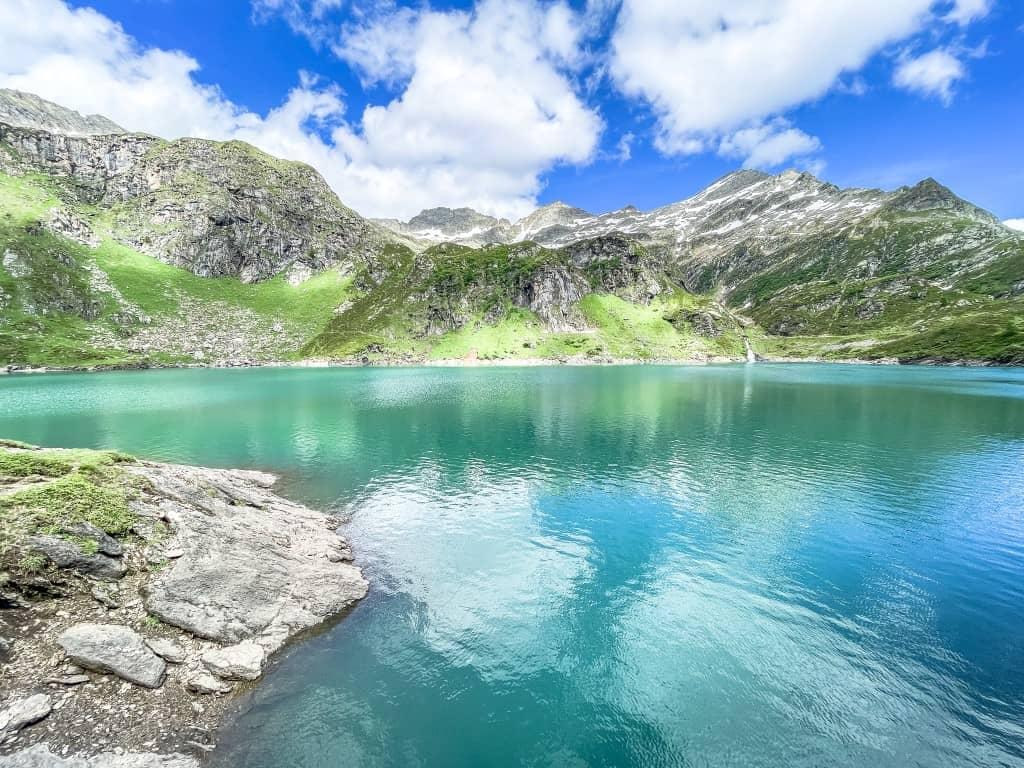 The view of Lago di Robièi over the lake and the mountains is breathtaking.