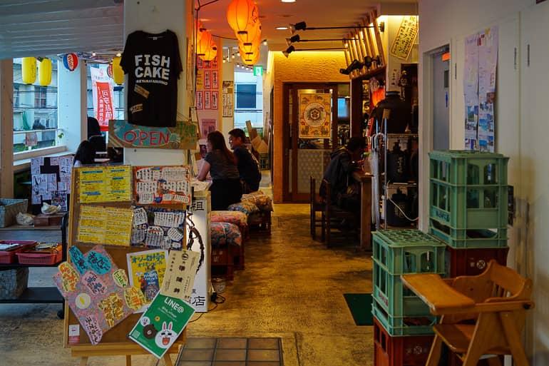 In the Yaeyama Islands in Japan, at Ishigaki Village Restaurant, various colorful decorations hang from the pillars and walls.