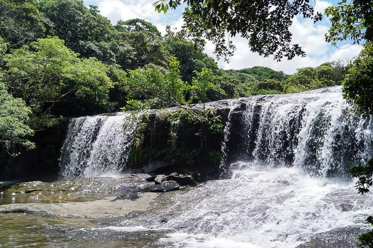 In the midst of dense nature, water cascades down the Sangara Waterfall on Iriomote in the Yaeyama Islands of Japan.
