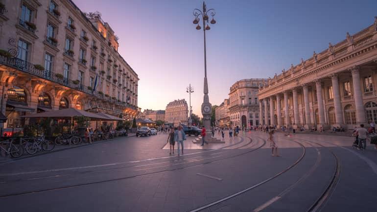 City trip: A square with old buildings at sunset.