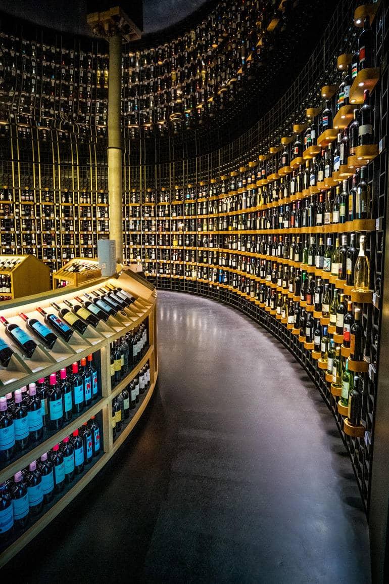 City trip: A large wine store with bottles reaching the ceiling.
