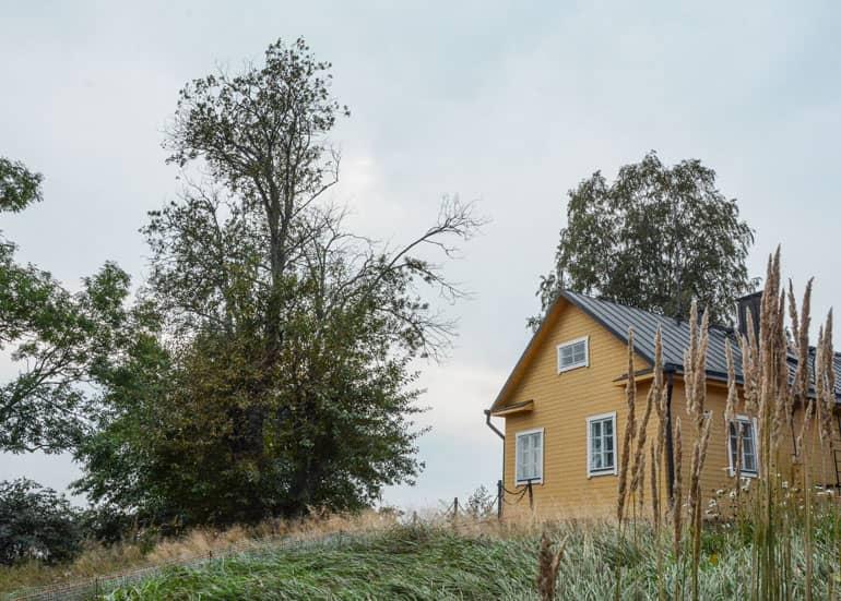 Helsinki: Yellow wooden house on a small hill.