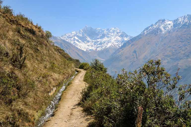 On the Salkantay Trek with a view of Machu Picchu.