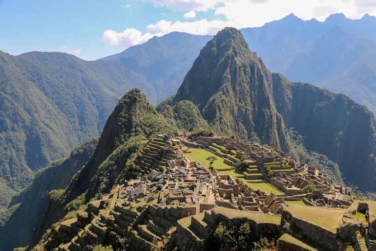 View of Machu Picchu with walls in the foreground.