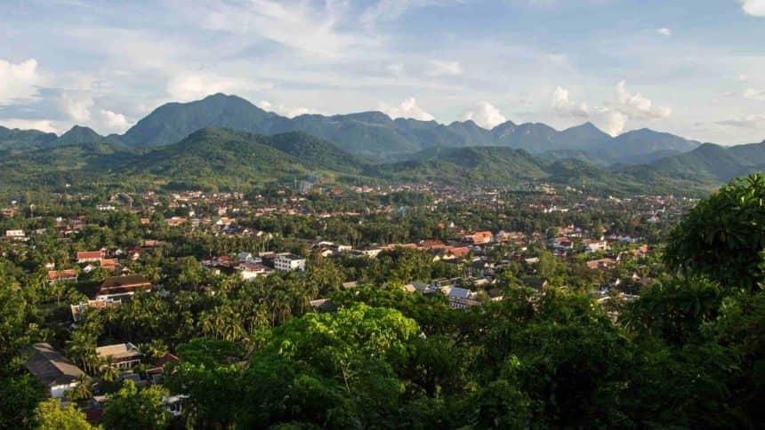 Luang Prabang in Laos is nestled in a picturesque green valley surrounded by mountains and is recognized as a UNESCO World Heritage Site.