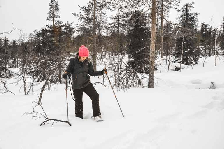 A woman snowshoeing in Finnish Lapland.